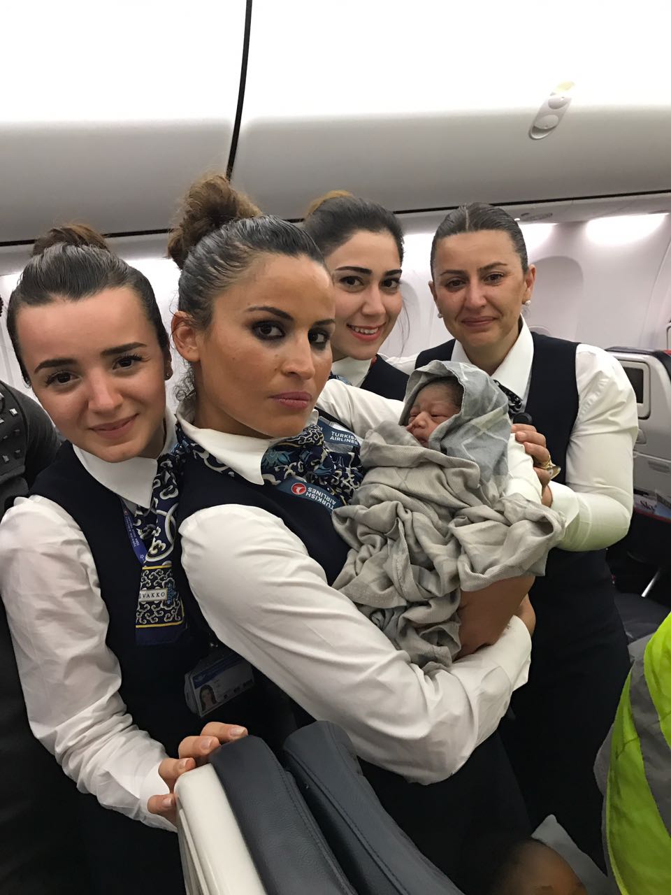 Turkish airlines crew with baby Kadiju